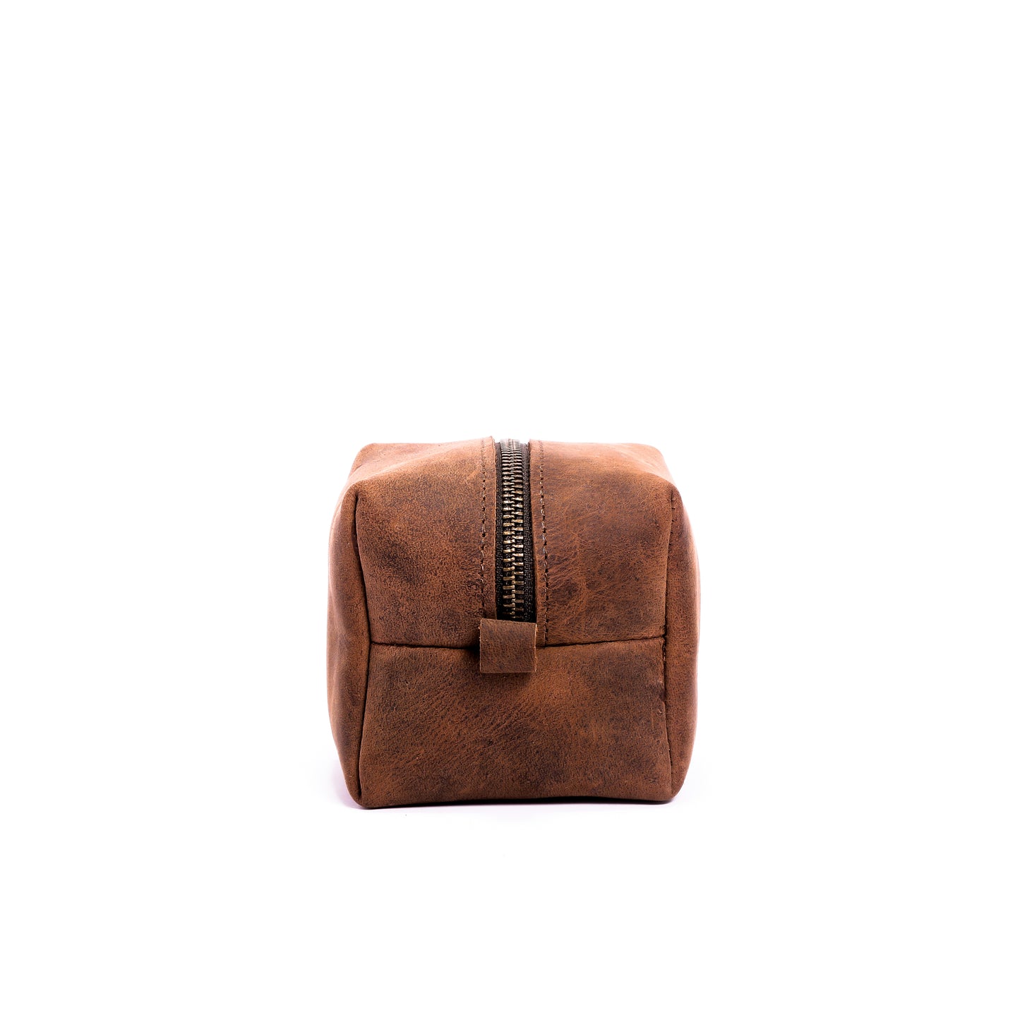 a brown leather toiletry pouch with one big compartment with zipper for travel needs , travel pouch, vanity pouch, leather bag, Genuine leather bag, toiletry pouch,nodes,nodes leather,nodes shop,nodes genuine leather,small size,pocket size,stylish,cosmetics,durable,luxury,leather.