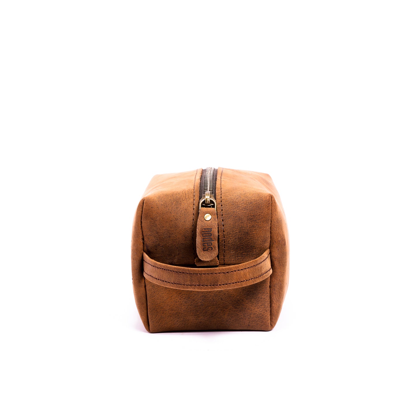 a brown leather toiletry pouch with one big compartment with zipper for travel needs , travel pouch, vanity pouch, leather bag, Genuine leather bag, toiletry pouch.